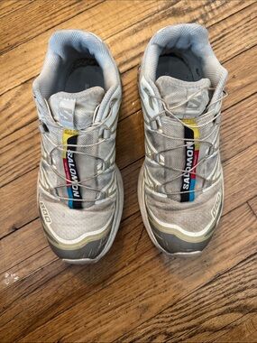 Salomon Light Gray Trail Shoes with Yellow, Blue and Red Accents